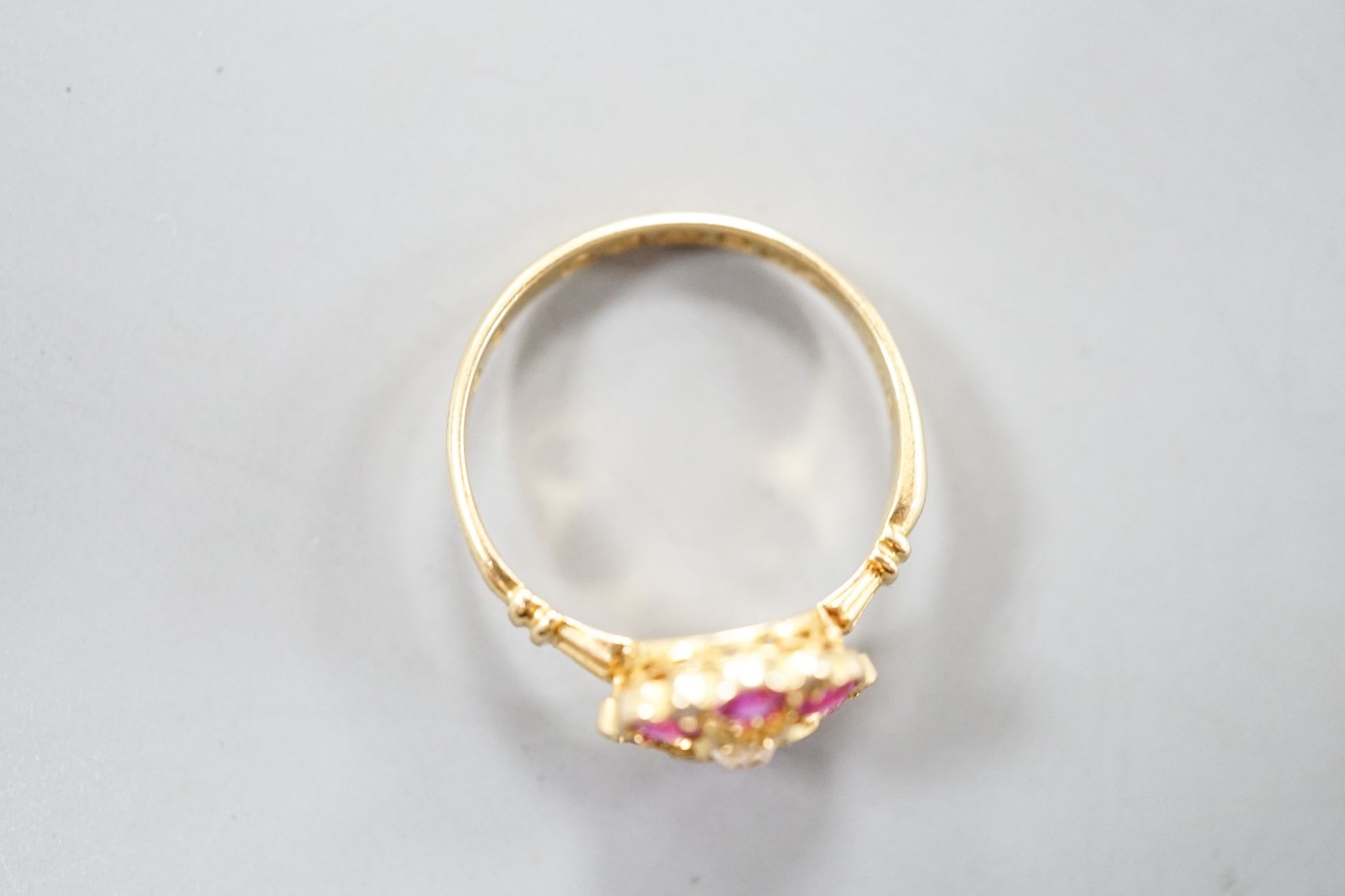 A George V 18ct gold, synthetic ruby, white sapphire? and diamond chip set cluster ring, size K, gross weight 2.4 grams.